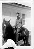 on horse in front of Ira Morse house